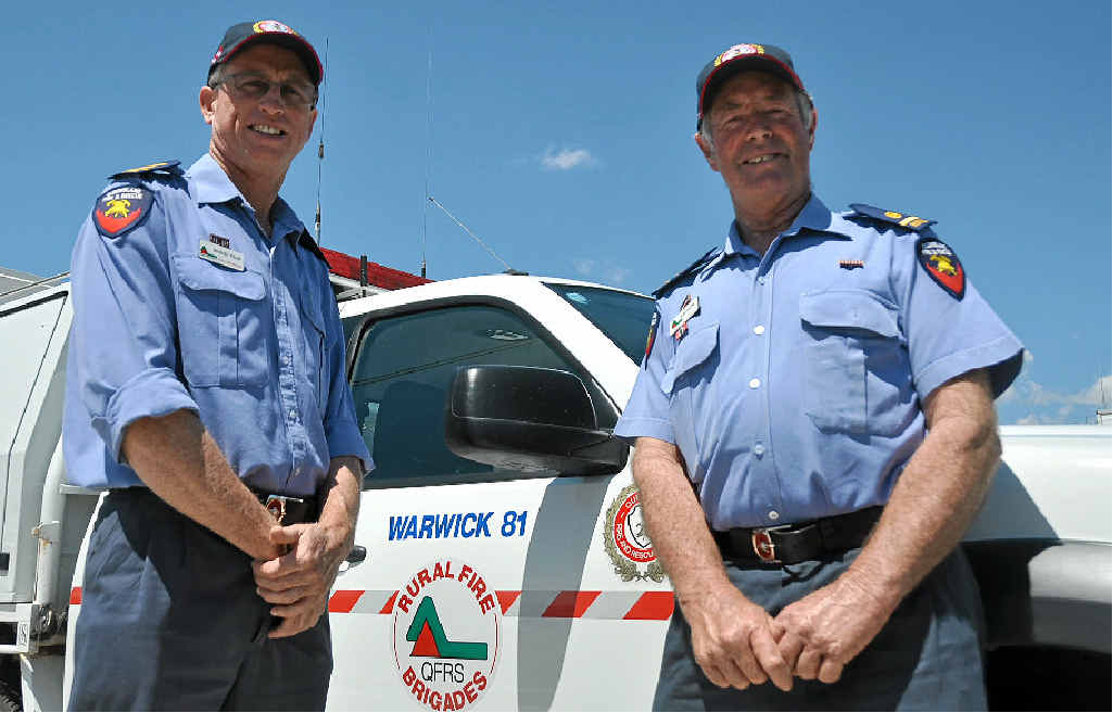 FAMILIAR FACE: Michael Welsh (L) has replaced Alan Payne as Warwick Rural Fire group officer. Mr Payne has stepped down to senior deputy group officer. FAMILIAR FACE: Michael Welsh (L) has replaced Alan Payne as Warwick Rural Fire group officer. Mr Payne has stepped down to senior deputy group officer.